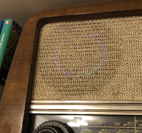 The Echo Dot blue light ring glowing in the tube radio