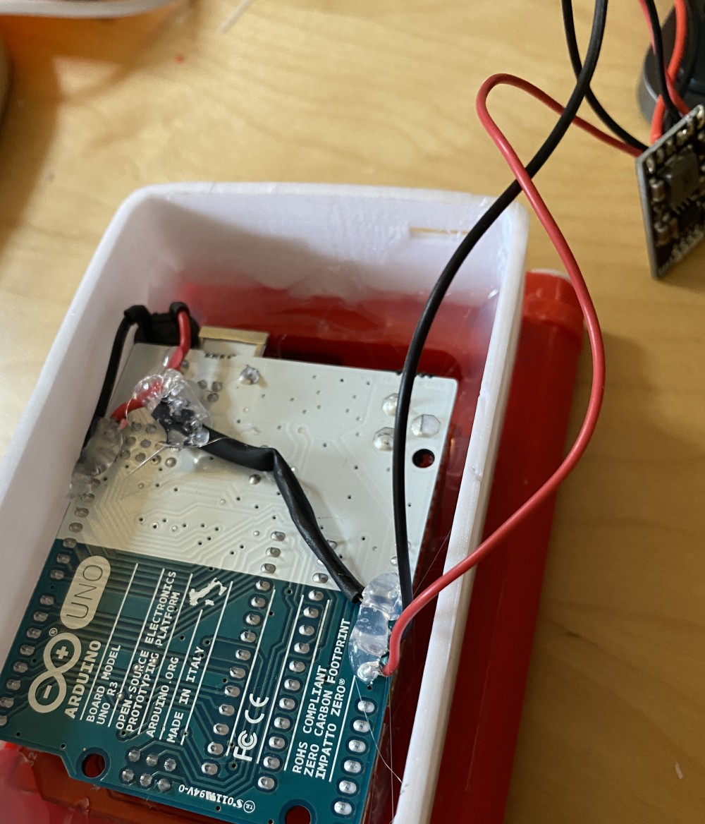 The Arduino and its display glued into the case