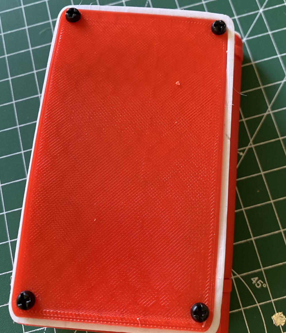 The backside of the Pokédex with the attached lid