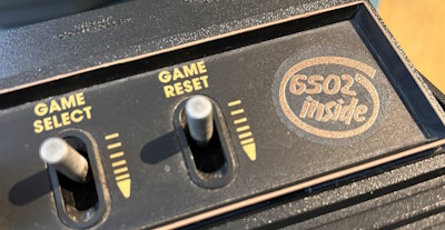 Atari 2600 front plate with "6502 inside" sticker