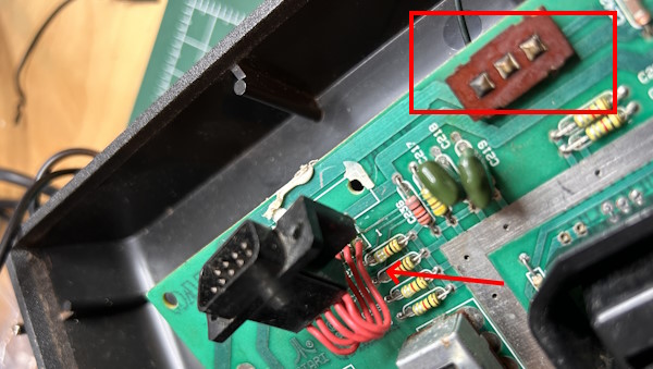 Atari 2600 board with a broken-off joystick port and missing switch