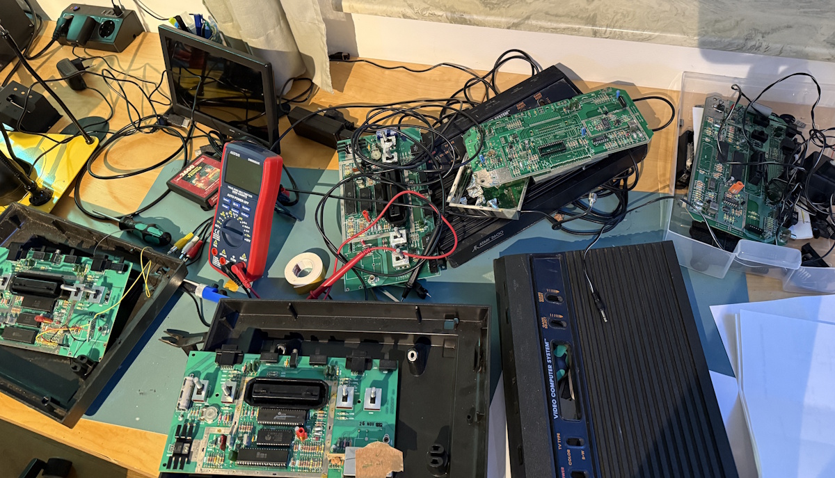 Multiple half-assembled Atari 2600s on my desk