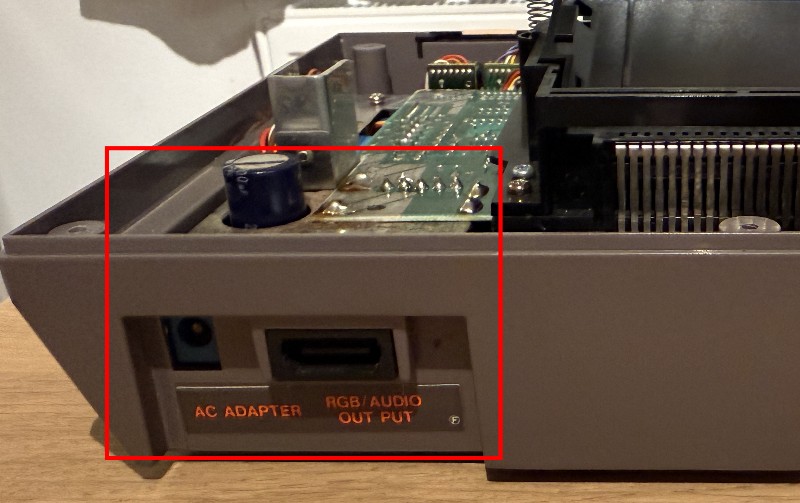 The NES with the default 9V barrel plug